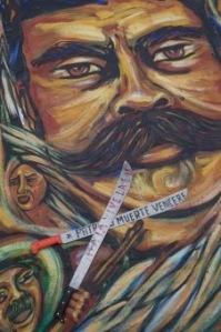 Machetes Crossed before Photo of Emiliano Zapata: "Fatherland or Death: We Will Conquer" Photo: Miguel Dimayuga