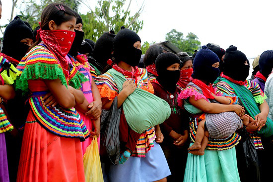 Zapatista youth and women form much of the current EZLN support base. This photo is from La Realidad during the homage to fallen Compañero Galeano – killed in a paramilitary attack in La Realidad on May 2, 2014. 